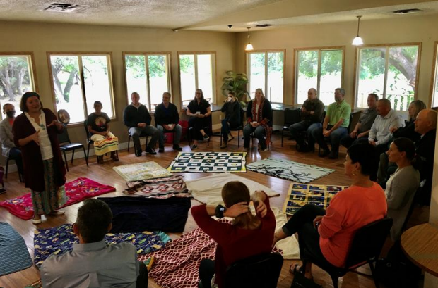 Employees take part in Blanket exercise with Cowessess First Nation.